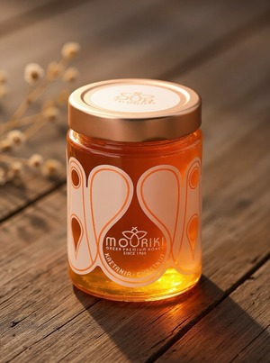 Jar of honey with a decorative label on a wooden surface